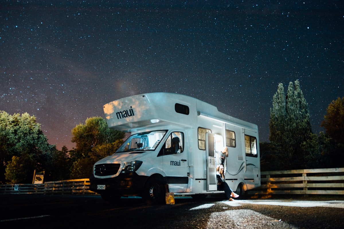 Family Class C RV at a campground with visible wheels